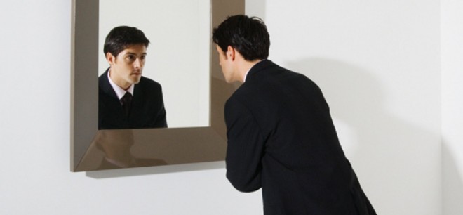 businessman-looking-in-mirror-pan_12170